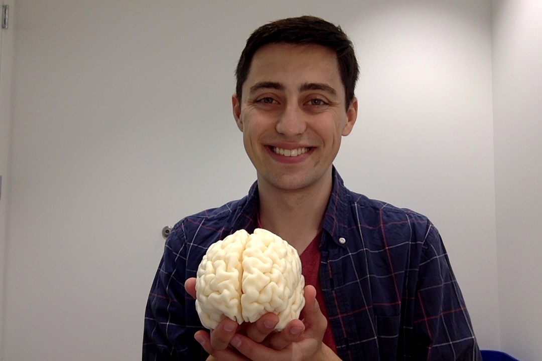 me holding a 3d printed copy of my brain